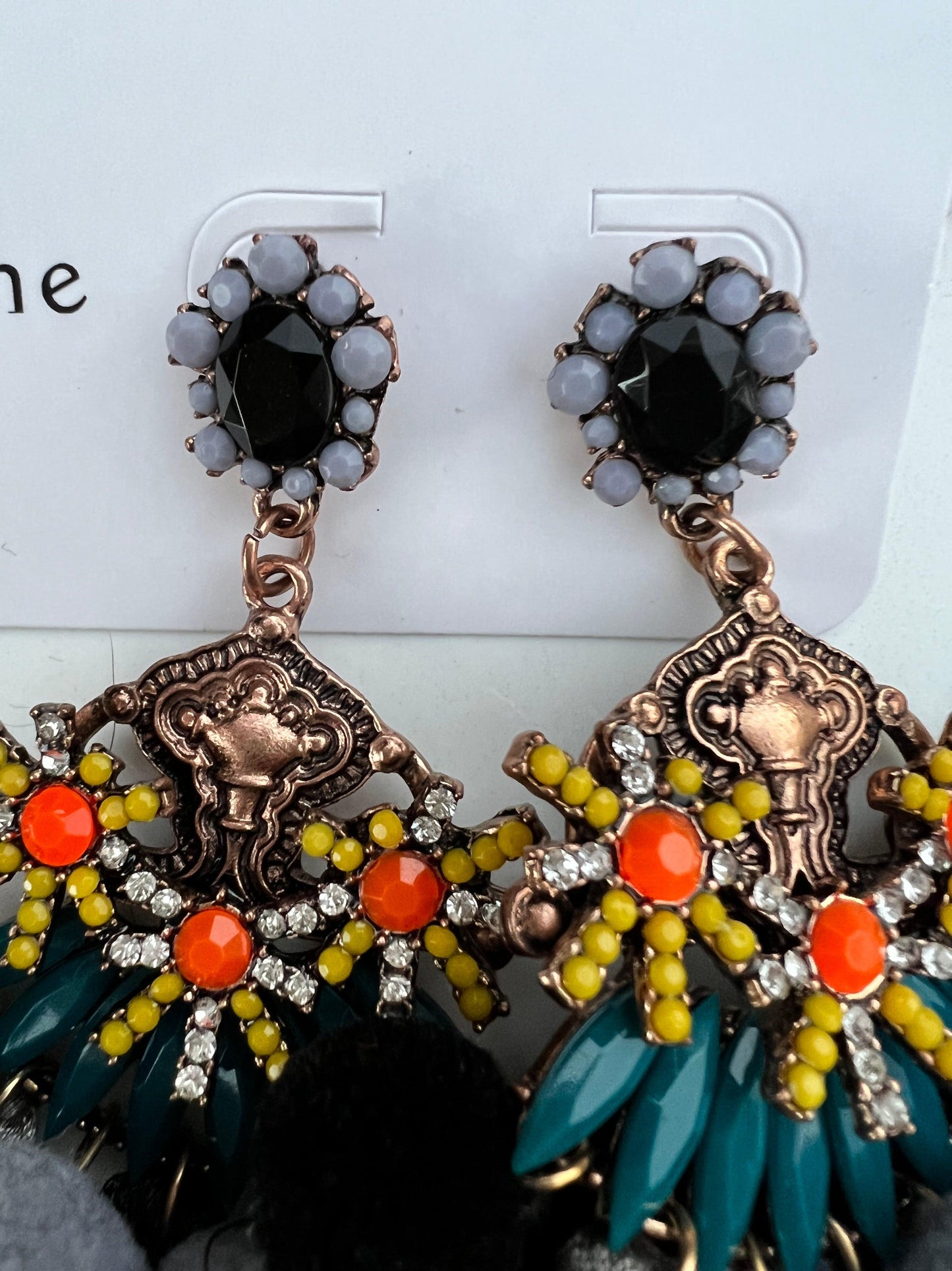 The perfect earring for a fun occasion, Florence has all the feels.   Pom Poms, Crystals, Beads & Tassels in a detailed setting.   Care is required to maintain tassel shape, this earring is on the heavy side so best worn for shorter periods, unless you are seasoned to the heavier pieces!  