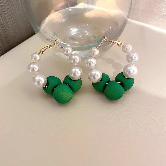 The most elegant Pearl and vibrant green bead combination. The weekend essential!