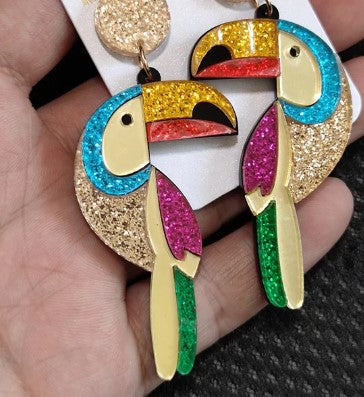 You can't beat a pair of statement earrings to bring a bit of joy and pizzazz to any outfit - even if its grey and miserable outside. Our Parrot acrylic dangle earrings are sure to dazzle.   All earrings come beautifully packaged in our Entire Me luxurious pouch. 
