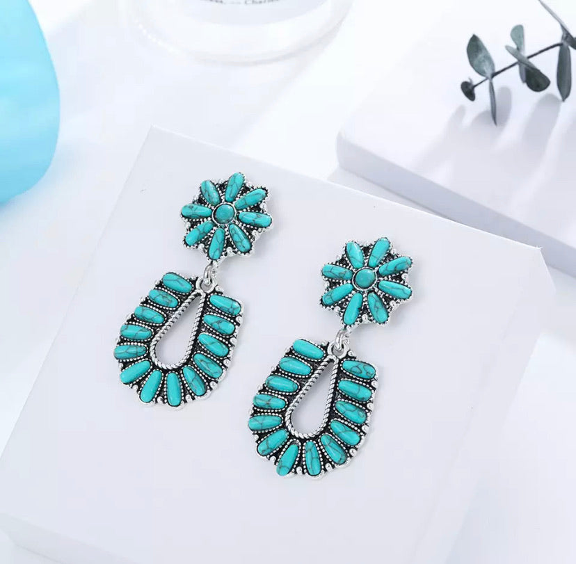 Chic medium sized turquoise statement earring drop set in vintage style mill-set framing. 