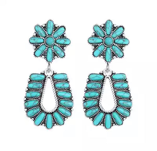 Chic medium sized turquoise statement earring drop set in vintage style mill-set framing. 