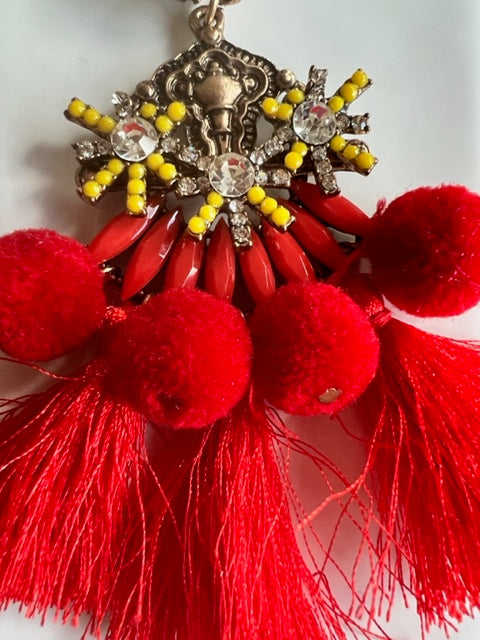 The perfect earring for a fun occasion, Florence has all the feels.   Pom Poms, Crystals, Beads & Tassels in a detailed setting.   Care is required to maintain tassel shape, this earring is on the heavy side so best worn for shorter periods, unless you are seasoned to the heavier pieces!  