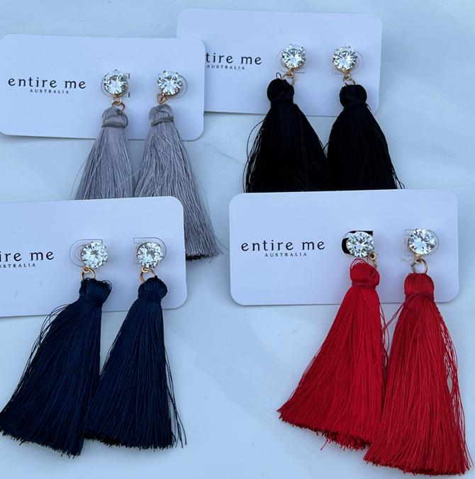 Streamline elegance with this crystal and tassel combination in a gold clasp setting.  Options include Red, Black, Navy & Grey.  Care maybe required with the delicate tassels to ensure shape is maintained, some trimming may be required with wear.    
